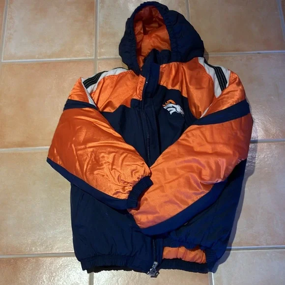 This is a boy’s large jacket. It is 100% polyester. The shell is 100% nylon. - Picture 3 of 6
